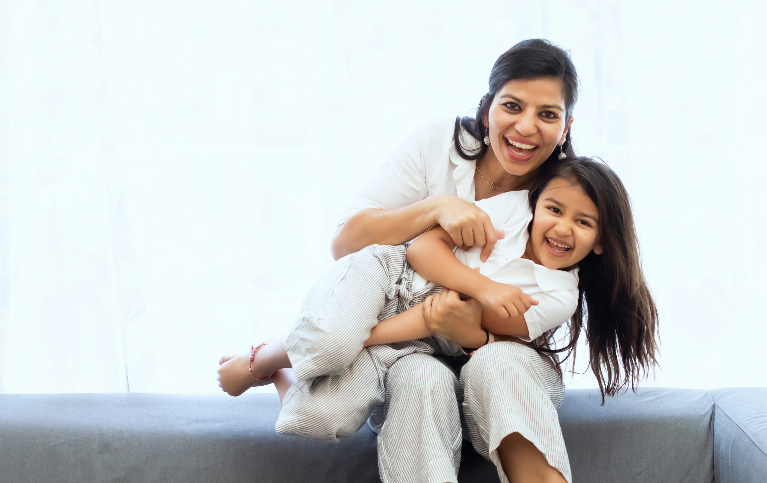 a mom and daughter smiling | centerforrisingminds.org