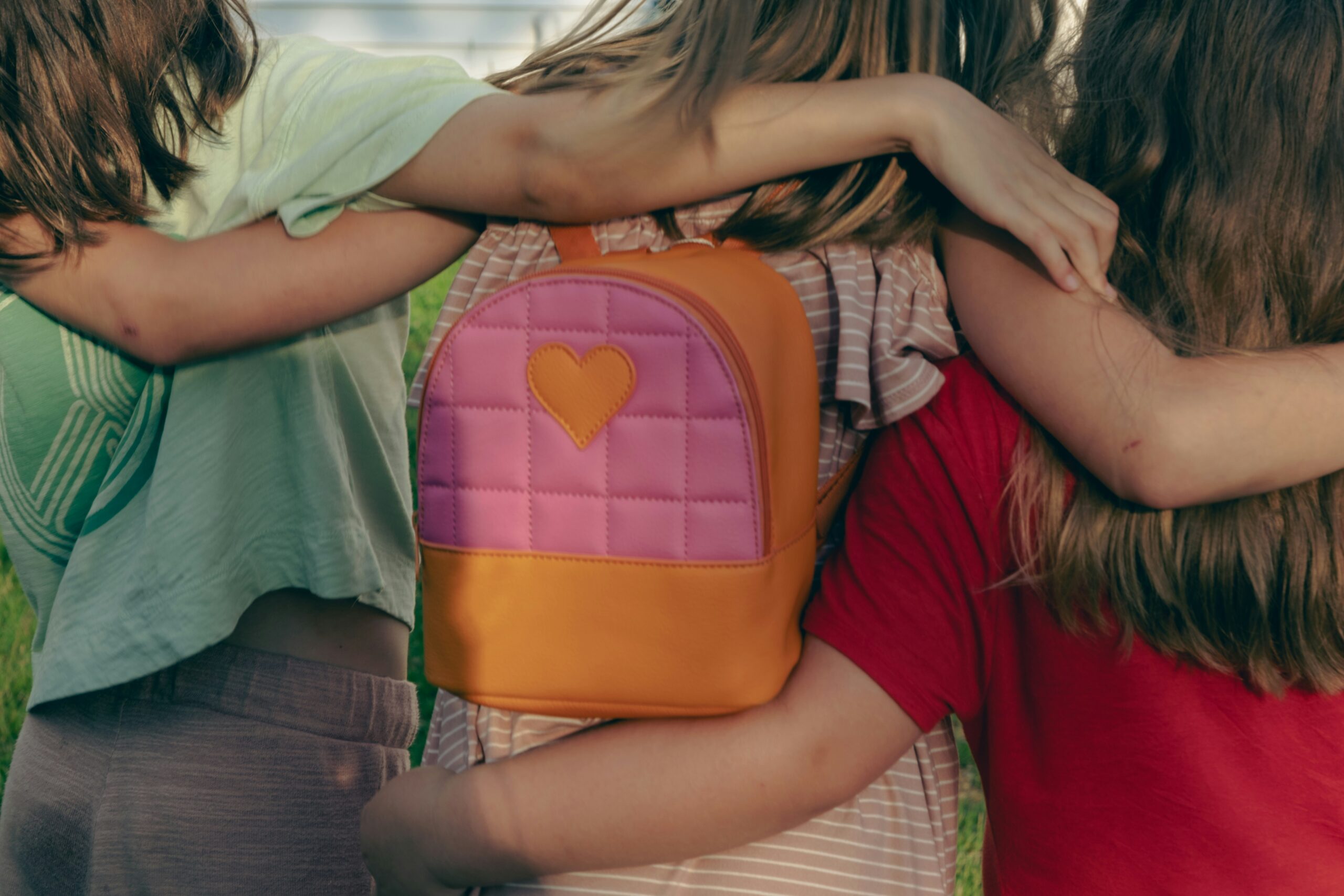 three young girls with a backpack | carlisledigitalmarketing.com