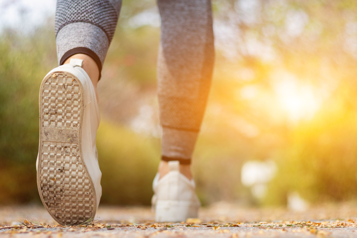 A foot stepping forward, symbolizing behavioral activation for ADHD and taking action before motivation.